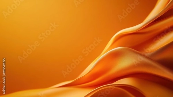 Fototapeta Elegant orange fabric drapes gracefully, showcasing smooth textures and vibrant hues, perfect for artistic and design backgrounds.