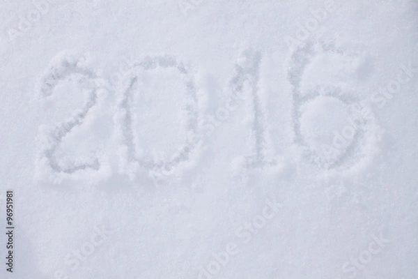 Fototapeta "2016" written on snow surface.