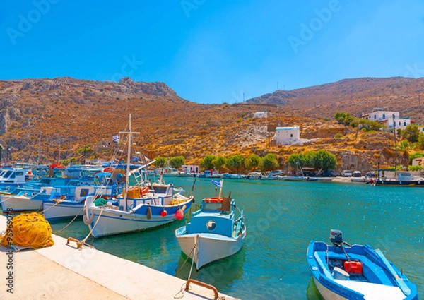 Fototapeta traditional fishing boats  docked at the port of Vathi village in Kalymnos island in Greece
