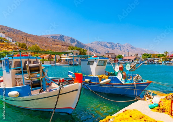 Fototapeta traditional fishing boats  docked at the port of Vathi village in Kalymnos island in Greece