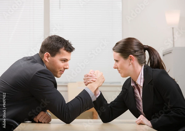 Obraz Co-workers aggressively arm wrestling for dominance