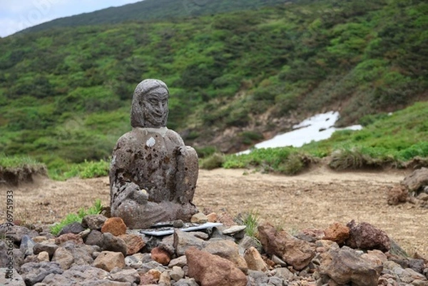 Fototapeta Statue of Yamamba, a mountain witch from Japanese folklore, on a mountain peak