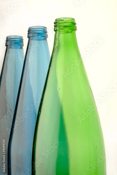 Fototapeta bottles from  glass of green and dark blue color
