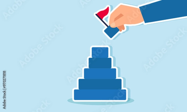 Fototapeta A businessman  hand holding the final puzzle piece of wooden blocks with a flag to complete the puzzle, illustration of A businessman trying to complete or finalize his business project