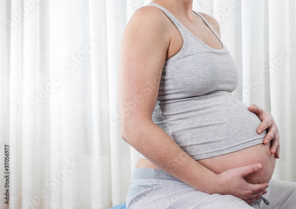 Obraz Siedząc kobietę w ciąży