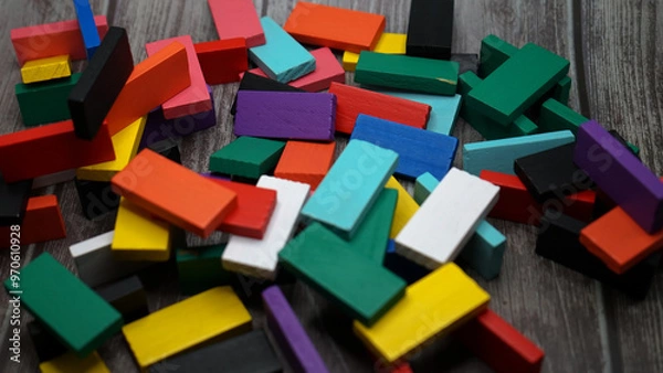 Fototapeta colorful bricks on white backgrounds in different positions and shapes making buildings
