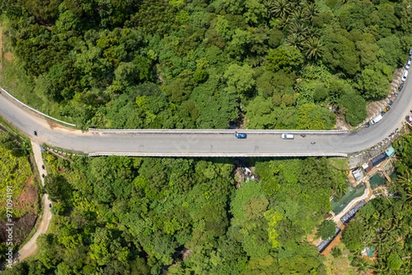 Fototapeta Aerial of Kakawayan Bridge, part of the scenic Marcos Highway, also known as Marilaque highway in Real, Quezon, Philippines.