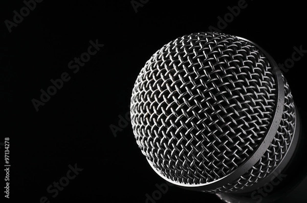 Obraz Silver microphone on a black background.