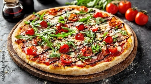 Fototapeta   A pizza rests atop a wooden cutting board alongside an array of juicy tomatoes and a bottle of fragrant olive oil