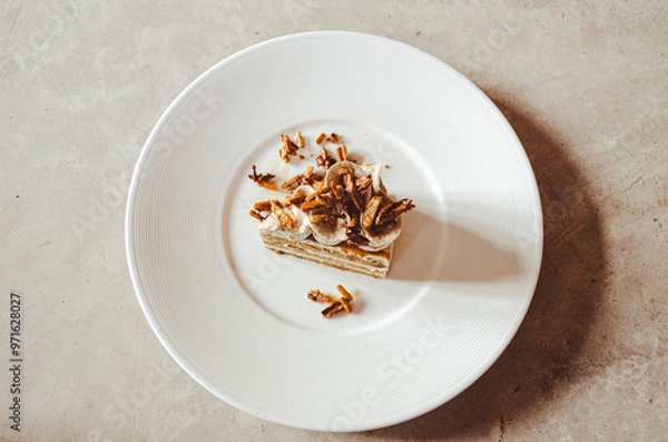 Fototapeta coffee almonds cake in white plate on loft background