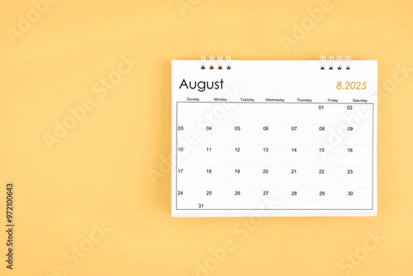 Fototapeta August 2025 desk calendar on yellow color background, position with copy space.
