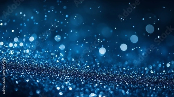 Fototapeta deep blue background with scattered silver glitter