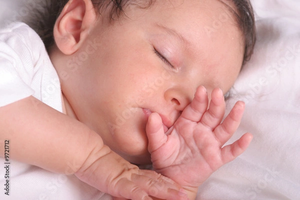 Fototapeta cute baby girl sleeping in her bed