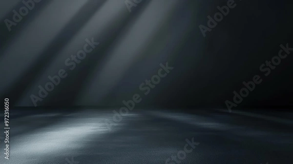 Fototapeta A dark, moody interior scene with soft light rays creating dramatic shadows on the floor.