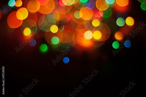 Obraz Light spots on black background