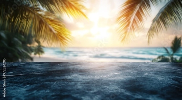Fototapeta A serene beach scene with palm trees and a sunset over the ocean.