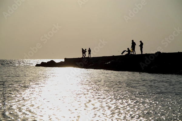 Fototapeta silhouette people on sunset