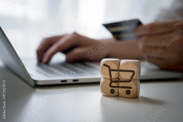 Obraz Man using credit card and laptop computer for online payment. Businessman or entrepreneur working from home. Online shopping, e-commerce, and internet banking concept.