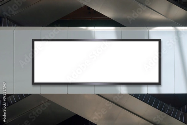 Fototapeta Mock up template: Long horizontal billboard out of home (OOH) advertising poster on side of parapet. Escalators in background. Light and shadow on frame. Transparent png file with shadows