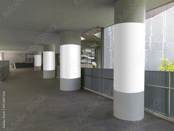 Fototapeta 4 vertical blank poster templates on round pillars. Advertising pillar wrap mock ups along corridor walkway. Transparent png file with shadows.