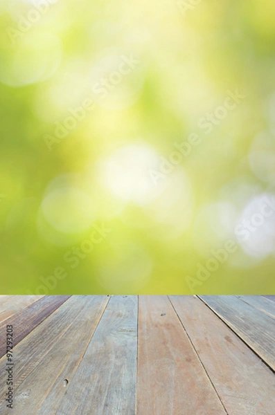 Fototapeta Empty wood table and green bokeh abstract background ,can be used for display your products