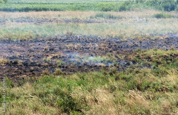 Obraz Burns peat fields through dry summer