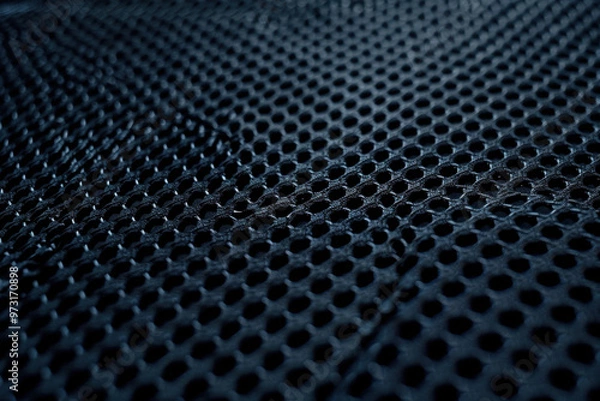 Fototapeta A dark blue mesh texture background featuring an intricate grid pattern
