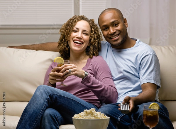 Obraz Relaxed couple with popcorn and remote control