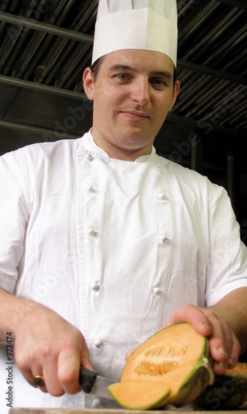 Obraz chef is slicing a melon