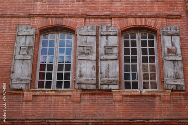 Fototapeta old windows in a brick wall
