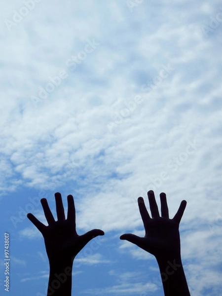 Obraz hands silhouettes and blue sky
