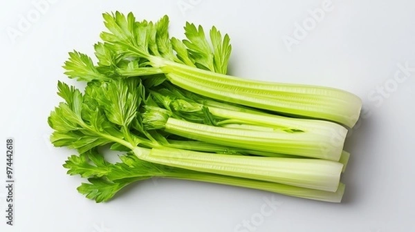 Fototapeta Fresh green celery stalks arranged on a clean surface, ideal for healthy cooking and nutrition-focused content.