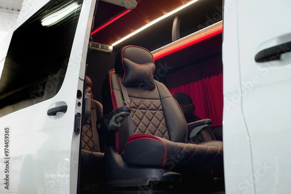 Fototapeta Comfortable interior of a passenger bus with soft seats. The design is made to order. Private covering of cars. Various elements of the bus interior.