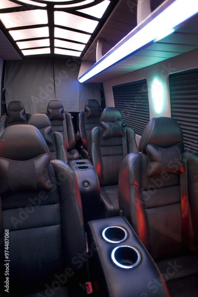 Fototapeta Comfortable interior of a passenger bus with soft seats. The design is made to order. Private covering of cars. Various elements of the bus interior.