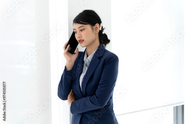 Fototapeta young businesswoman Standing at a window with light