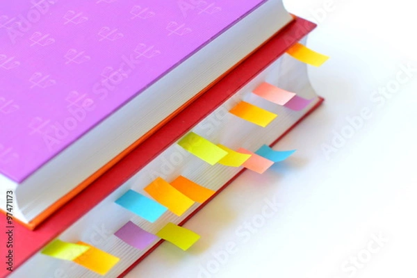 Fototapeta Book with post-it notes/book with colorful post-it notes on white background.