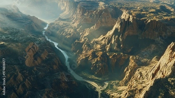 Fototapeta Aerial perspective of a canyon, capturing its depth and rugged terrain, shadows cast by the afternoon sun