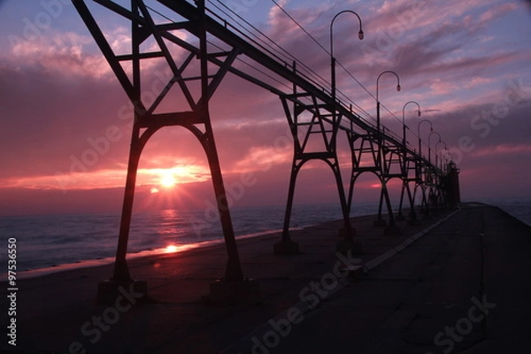 Obraz Beautiful bridge and lighthouse over the sunset.