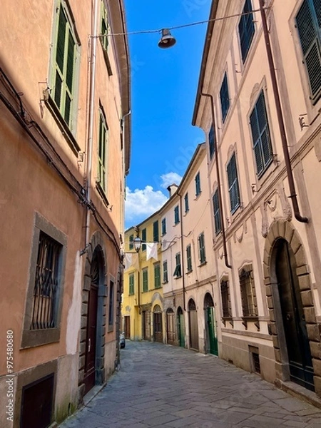 Obraz Characteristic, cobblestone streets of Pontremoli in northern Tuscany,  Colourful buildings and no people. 