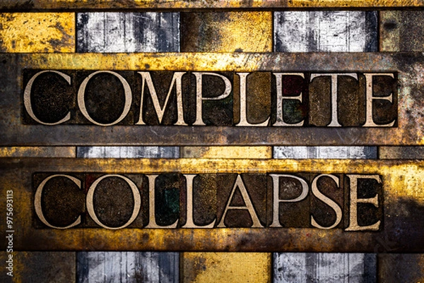 Fototapeta Complete Collapse text in real authentic typeset letters on vintage textured silver grunge copper and gold background