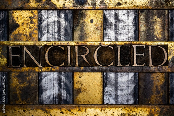 Fototapeta Encircled text in real authentic typeset letters on vintage textured silver grunge copper and gold background