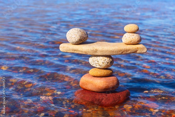 Fototapeta Symbolic scale of the stones on sea background. Concept of harmony and balance. work-life, emotional balance.