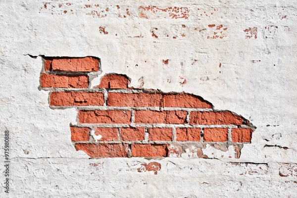 Obraz Texture of an old brick wall with damaged plaster and cracked white paint.