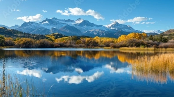 Fototapeta A tranquil lake with reflections of the Colorado Mountains in the background
