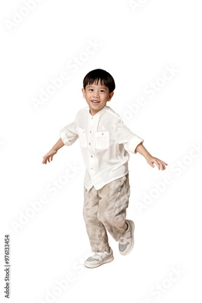 Fototapeta Happy Asian young boy in casual attire, smiling and playing, isolated on white background. Perfect for family and childhood themes. transparent PNG white background.