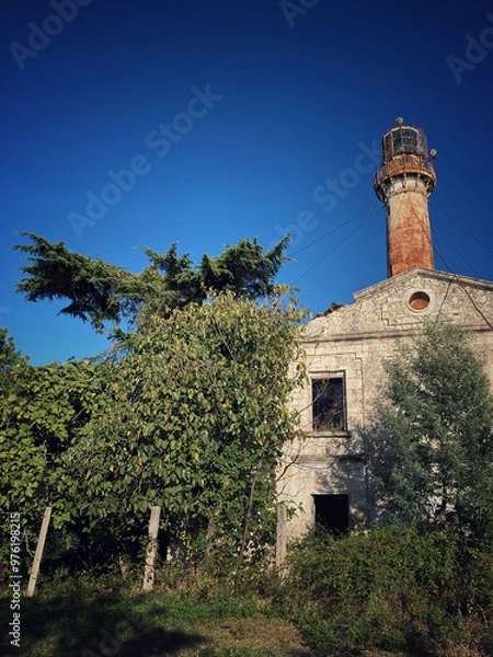 Obraz old lighthouse on the hill