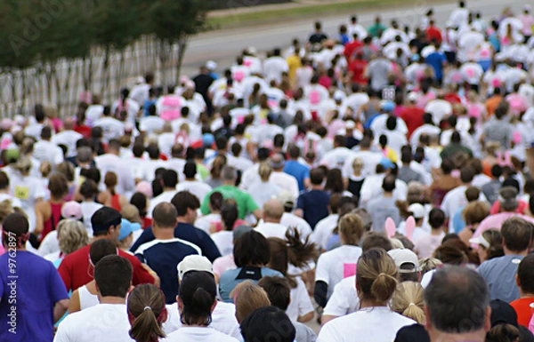 Fototapeta Crowd running a race on the city streets.