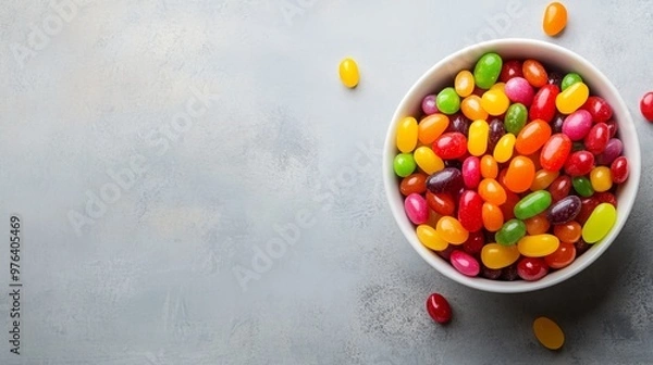 Obraz A vibrant bowl of colorful jelly beans on the right side, with the left side left clear for text. Perfect for candy promotions, festive events, and sweet treats.