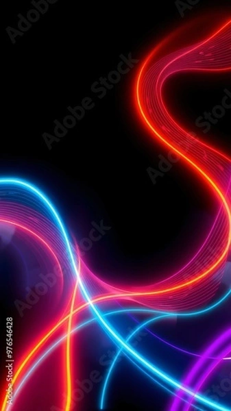 Fototapeta Vibrant neon light trails in swirling patterns against a dark background, creating a mesmerizing art display