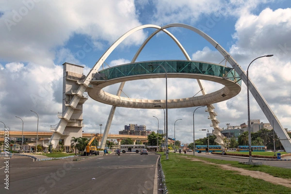 Fototapeta The famous Biswa Bangla Gate, an amusement center at Rajarhat, along with view of morning traffic on the city road at Kolkata, India